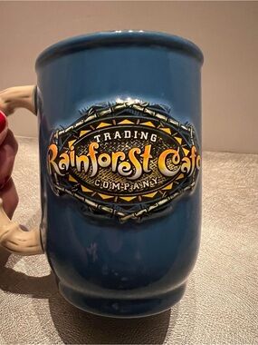 Rainforest Cafe 3D Logo Ceramic Coffee Mug Simulated Bamboo Handle 16 oz Blue.